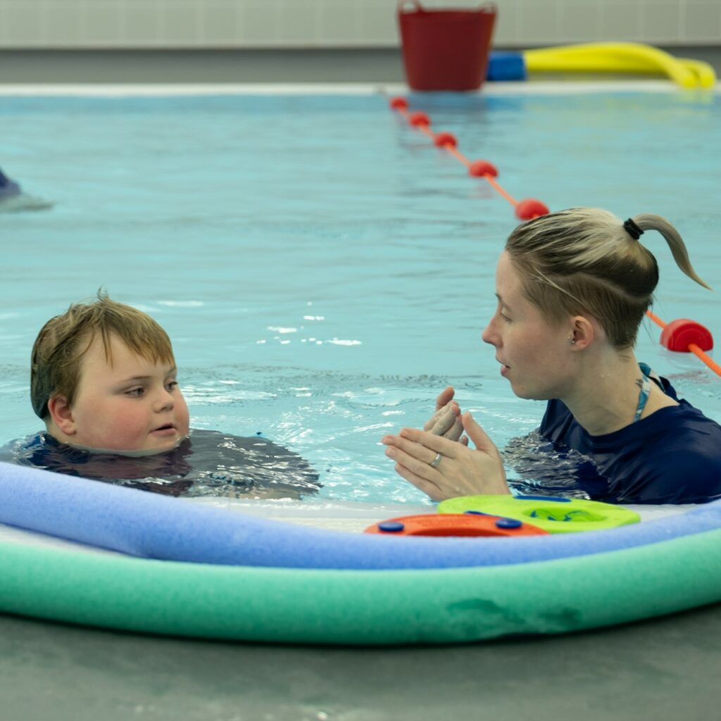 A teacher and a student in a swimming pool at Seashell